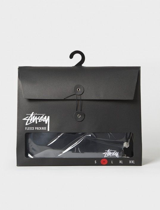 Stüssy premium matte black fleece apparel packaging with hanger